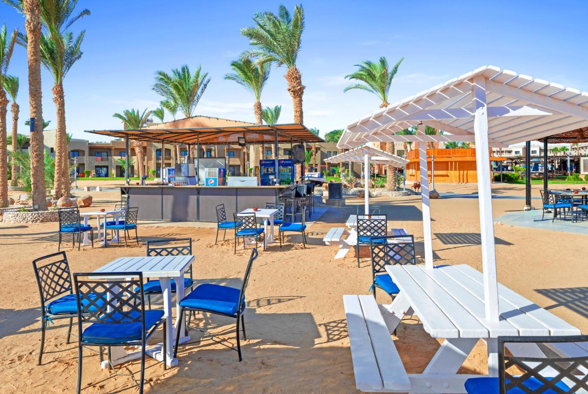 Pickalbatros Oasis Port Ghalib Hotel Exterior photo Beach bar at a resort in Egypt